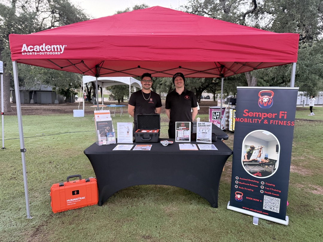 Sunshine Run booth setup with VALD HumanTrak and Semper Fi banner