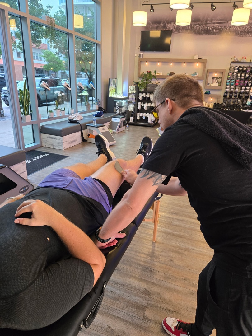 Trey doing body scraping work on a client